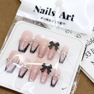 Pink gradient and black French press-on nails with bow, rhinestones and glitter