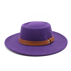 Close-up of purple wool felt hat with double brown leather straps and metallic rivets