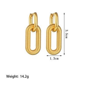 Textured gold oval hoop earrings with measurements 3.5cm by 1.3cm on a white background
