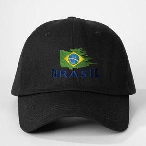Detailed close-up of blue BRASIL embroidery and flag on a black cotton baseball cap