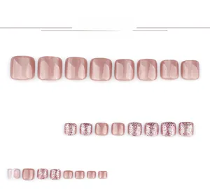 Detailed view of pink cat-eye and silver glitter press-on toenails for summer