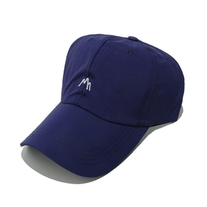 Detailed view of the mountain peak embroidery on this dark blue baseball cap