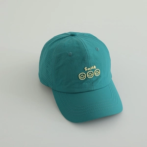 Close-up of lightweight blue baseball cap with smile embroidery and mesh vent details