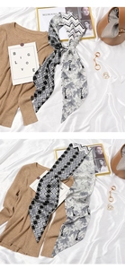 Detail of double-sided twilly silk scarf with geometric patterns and floral motifs