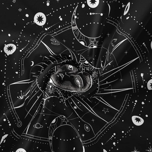 Detail showing smooth fabric texture with celestial sun and moon astrological patterns