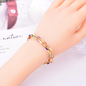 Colorful enamel link chain bracelet in gold finish worn on wrist for fashion