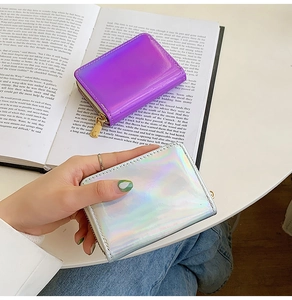 Macro detail of laser holographic mini wallets with premium gold metallic zippers