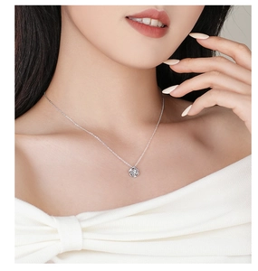 Close-up of S925 sterling silver rose pendant necklace with zircon inlay on neck