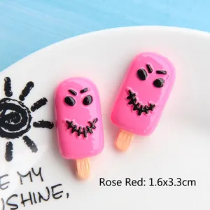 Macro detail of rose red popsicle resin craft with devil face on blue background
