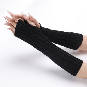 Detailed knit texture and fingerless design of black long arm warmers on model