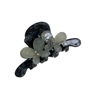 Elegant marble grey hair claw clip featuring rhinestone butterfly charms and a secure grip