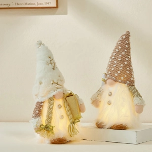 Glow-in-the-dark Christmas gnomes with warm LED lights and plush sequin hats for decor