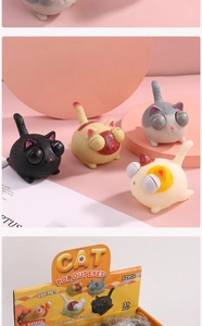 Detail of four colorful squeeze cat toys with pop-out eyes in professional display box