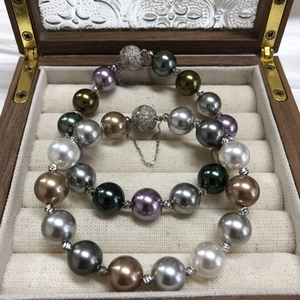Elegant multi-color pearl bracelets with crystal pavé magnetic clasp in a wooden box