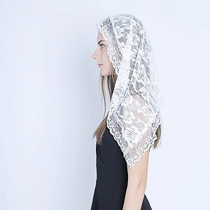 Elegant white lace Mantilla bridal veil with floral embroidery on studio background