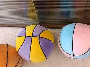 Plush basketball throw pillows in pink, blue, orange, and yellow purple color options