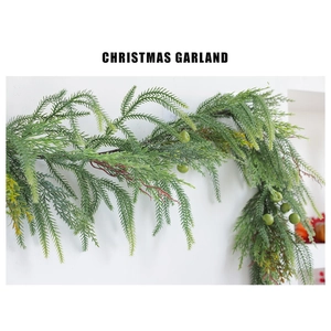 Close-up of Christmas garland with realistic green pine needles and light green berries