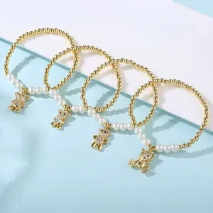 Gold beaded stretch bracelets set with sparkling rhinestone teddy bear charms and pearls