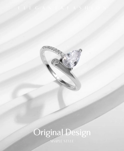 Detailed view of s925 silver ring featuring pear-cut zircon and pave-set diamonds