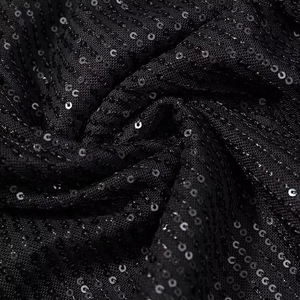 Sparkly black sequin party dress with mesh fabric and elegant back lace-up detail