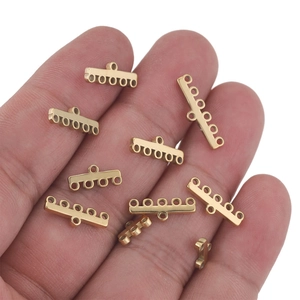 Golden stainless steel multi-hole connectors for DIY jewelry making held in hand