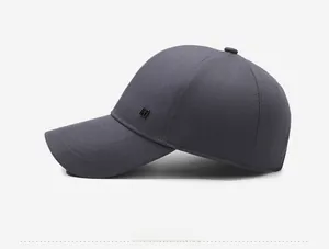 Detailed side view of a dark gray baseball cap with twill fabric texture and square logo