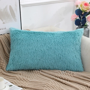 Luxurious turquoise long plush faux fur rectangle pillow cover on a cozy sofa