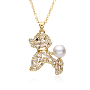 Close-up of a gold-plated poodle pendant with cubic zirconia and a white pearl accent