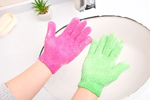 Detailed texture of pink and green exfoliating shower gloves with scrubbing surface