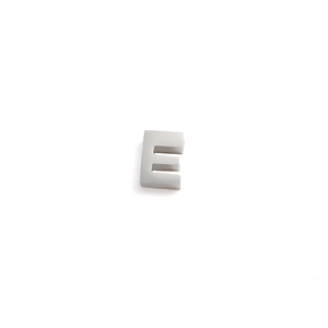Detailed view of a silver letter E charm pendant with a polished stainless steel finish