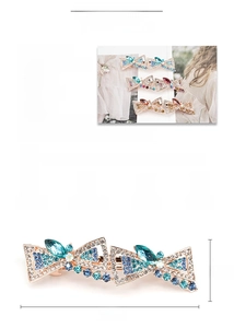 Macro shot of rose gold alloy spring hair clip with multi-color rhinestones and 8.5cm size