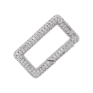 Macro view of silver-plated rectangular lobster clasp paved with sparkling zircons