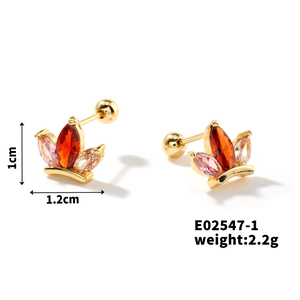 Detail showing crown-shaped copper stud earrings with cubic zirconia and screw back
