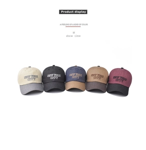 Detail view of cotton baseball caps with New York City 3D embroidery in five color options