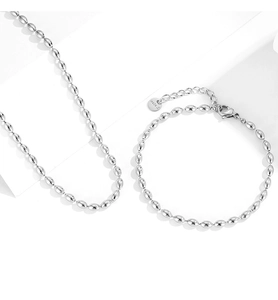 Detailed macro of polished stainless steel oval bead necklace and bracelet set