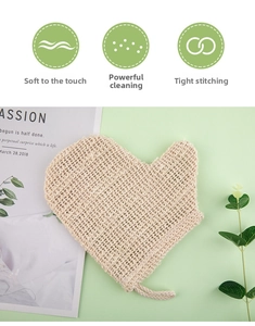 Detail of heart-shaped sisal bath glove with woven texture and a convenient hanging rope