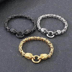 Three men's punk skull bracelets in black, silver, and gold with Byzantine chain details