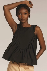 Detail of black sleeveless top featuring crew neck and pleated triangle cut-out design