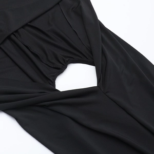 Detail shot of black bodycon dress featuring hollow-out back design and fine stitching