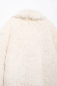 Close-up of the beige faux fur texture and turn-down collar on the back of the coat