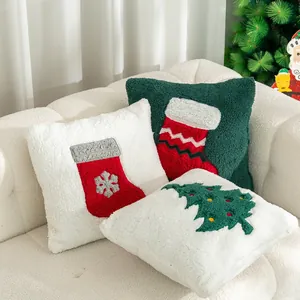 Christmas sherpa pillows set featuring embroidered Santa tree and sock on cozy white sofa