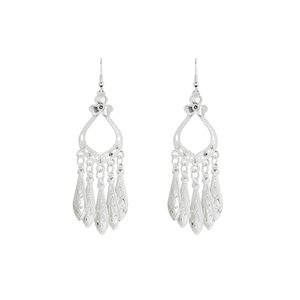 Detailed shot of ethnic silver fringe earrings featuring hollow leaves and teardrop pendants