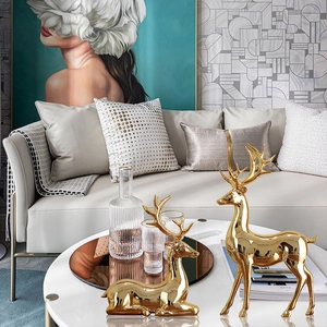 Golden plated deer figurines set of two in standing and sitting poses for home decor
