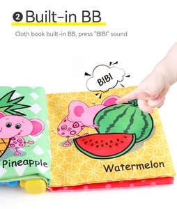 Detail of infant cloth book showing soft texture with pineapple print and built-in squeaker
