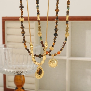 Retro beaded necklace set with sun pendant and brown stone in gold finish