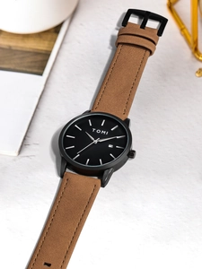 Detail of TOMI minimalist black dial watch with brown leather strap and date display