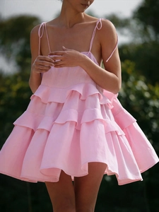 Pink tiered ruffle strap dress in linen fabric with a breezy A-line summer silhouette