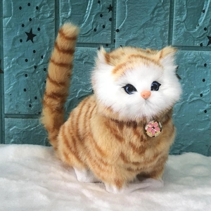 Lifelike orange tabby cat plush toy with blue eyes and pink flower pendant on white base