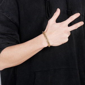 Close-up of a gold-toned men's box chain bracelet in durable stainless steel