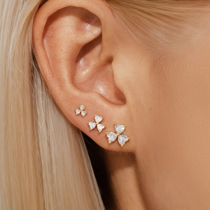 Detailed macro view of S925 silver clover stud earrings set with shiny cubic zirconia
